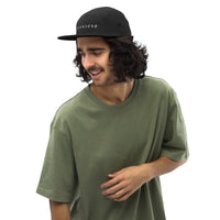 SNDT Essential Cap in black, five-panel camper cut, front view